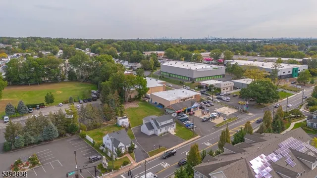 an aerial view of a city with lots of residential buildings lake and ocean view