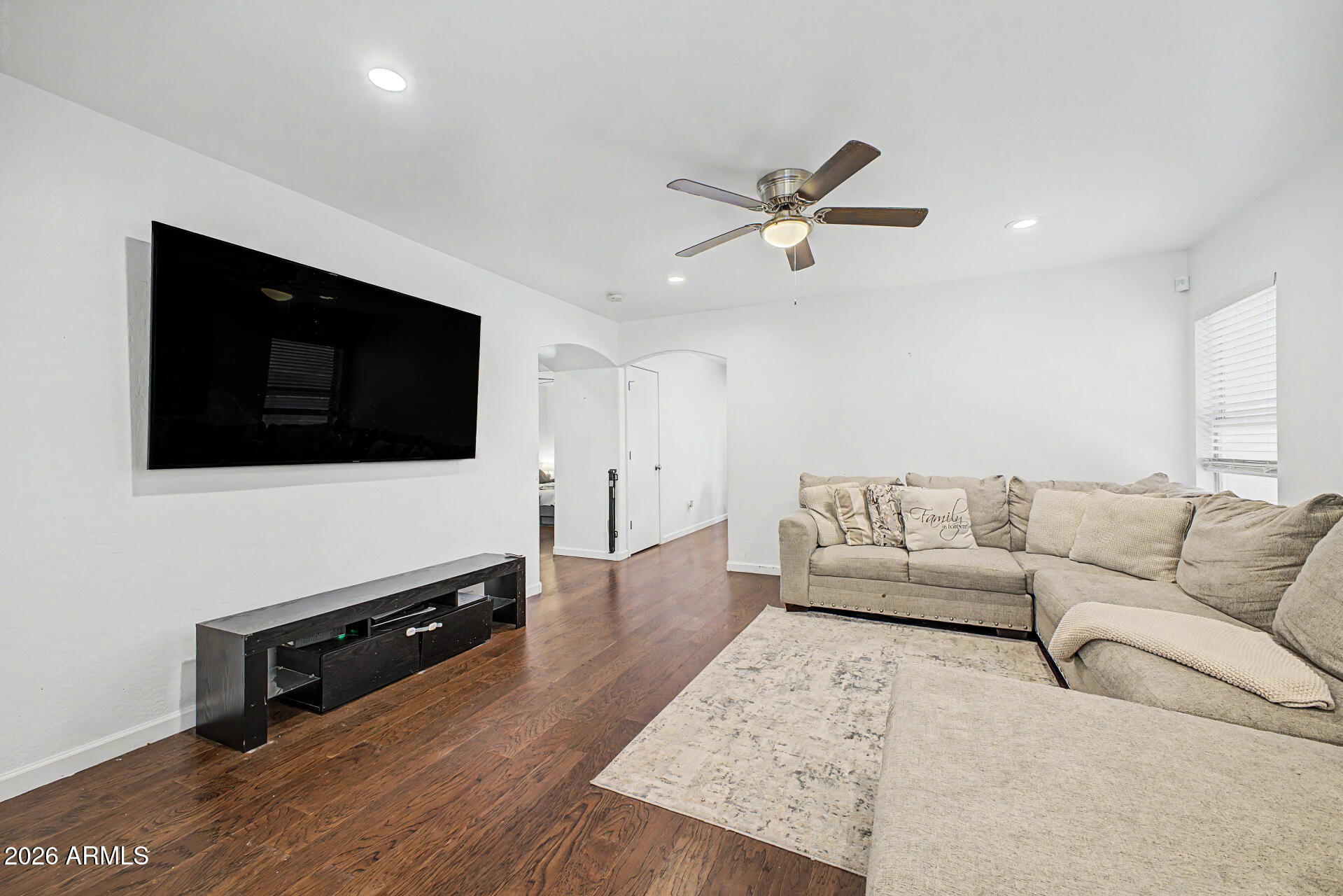 12008 West Larkspur Road El Mirage, AZ 85335 - Photo 5 of 25 a living room with furniture and a flat screen tv