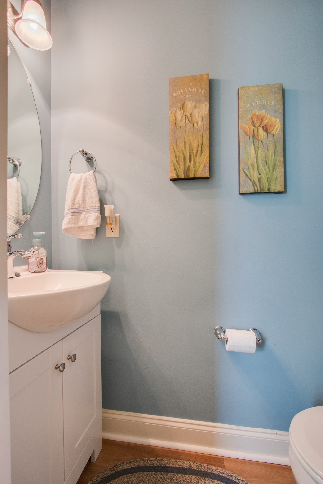 735 Tulip Grove Road, Unit 211 Hermitage, TN 37076 - Photo 12 of 26 a bathroom with a sink mirror vanity and toilet