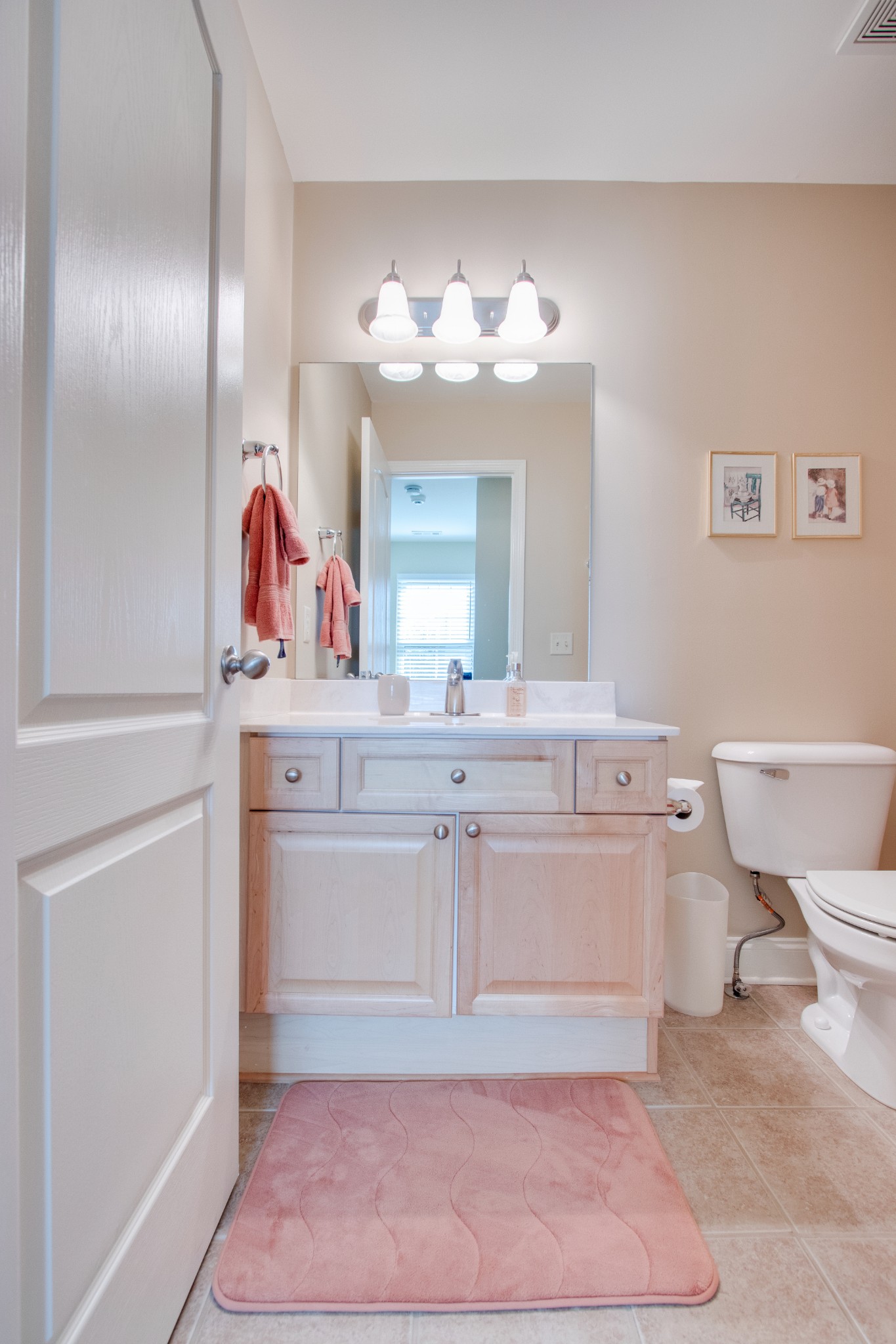735 Tulip Grove Road, Unit 211 Hermitage, TN 37076 - Photo 21 of 26 a bathroom with a sink vanity and a mirror
