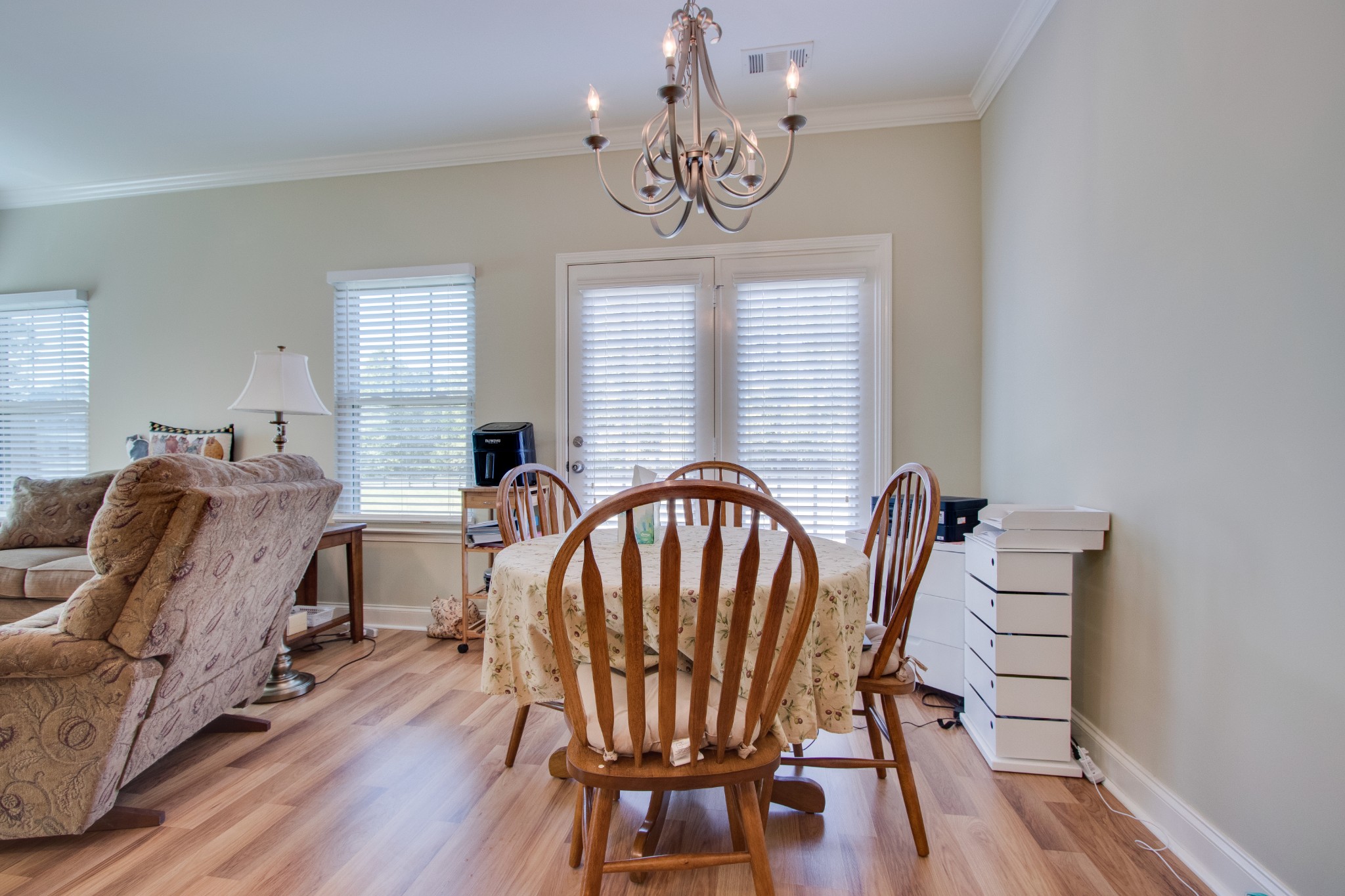 735 Tulip Grove Road, Unit 211 Hermitage, TN 37076 - Photo 8 of 26 a view of a dining room with furniture window and wooden floor