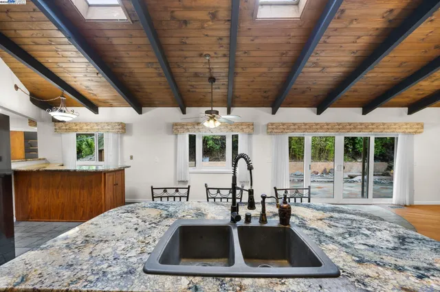 a kitchen with sink and stove