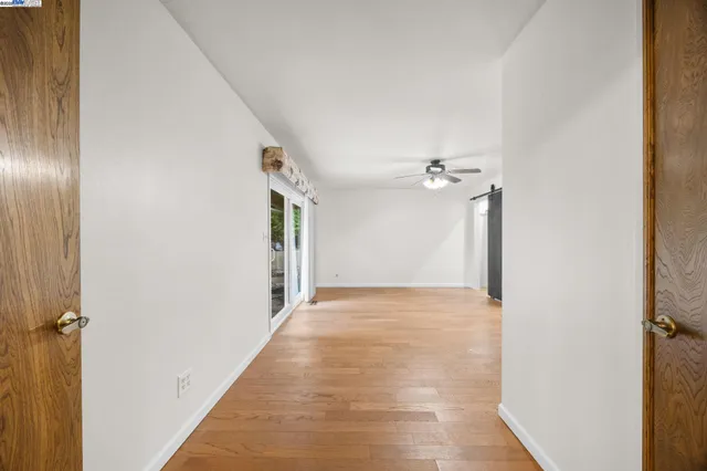 a kitchen with a sink a stove and chairs