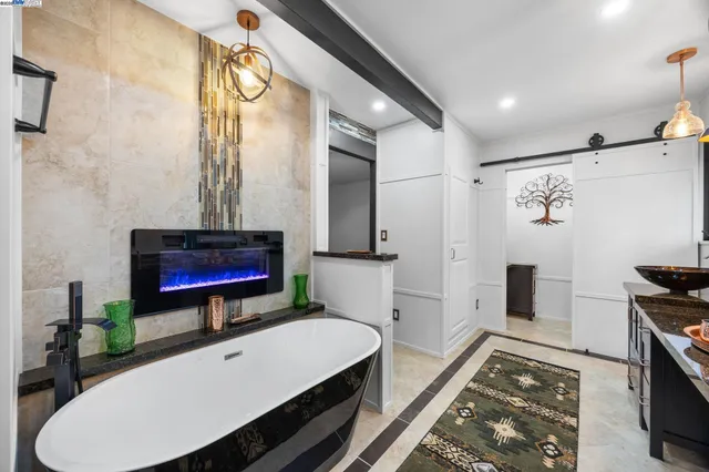 a view of an empty room with a ceiling fan