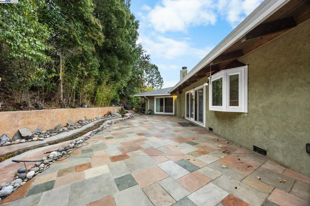 an aerial view of a house with a yard and garden