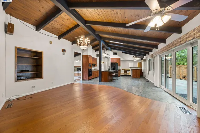 a kitchen with stainless steel appliances granite countertop a stove and a refrigerator