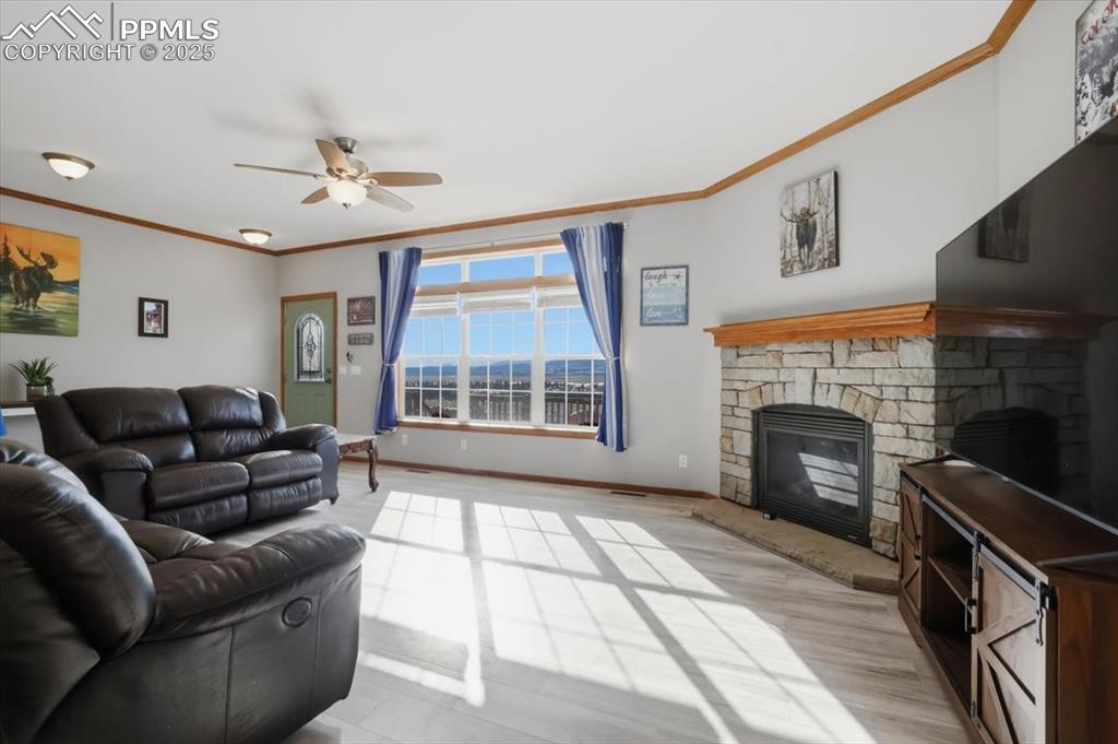 204 Crooked Creek Road Fairplay, CO 80440 - Photo 12 of 50 a living room with furniture and a fireplace