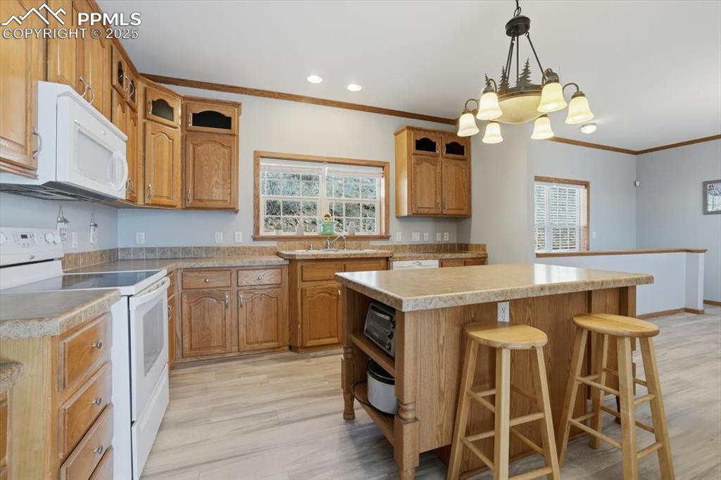 204 Crooked Creek Road Fairplay, CO 80440 - Photo 13 of 50 a kitchen with a stove a sink and a refrigerator