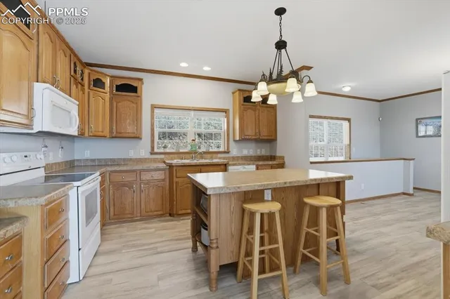 a kitchen with a table and chairs in it