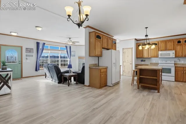 a bathroom with a granite countertop sink and a toilet