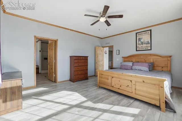 a bedroom with a large bed and a large window