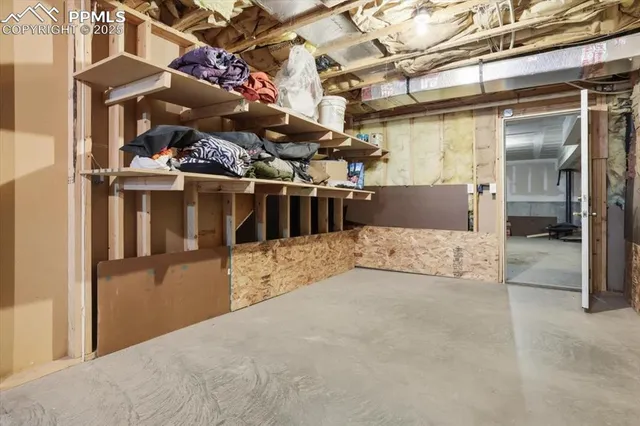 a spacious bedroom with a bed and a window