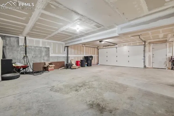 a view of a garage with parked cars