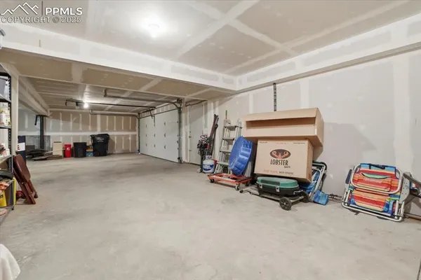 a view of balcony with chairs and wooden fence