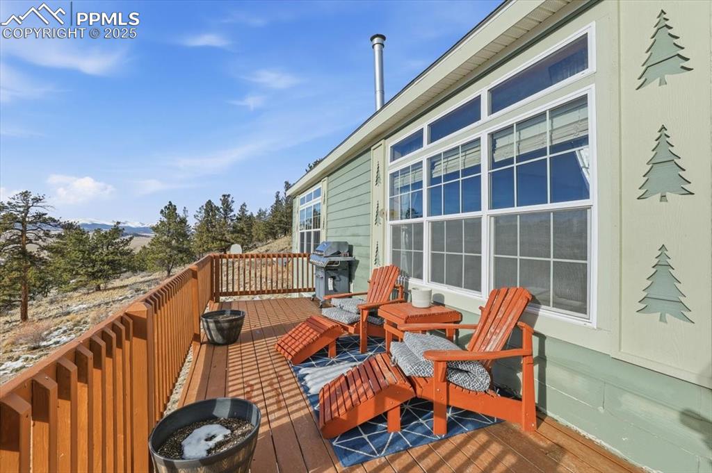 204 Crooked Creek Road Fairplay, CO 80440 - Photo 47 of 50 a view of balcony with couch and chairs