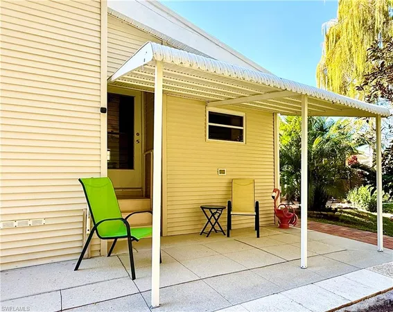 a view of a two chairs and table in the balcony
