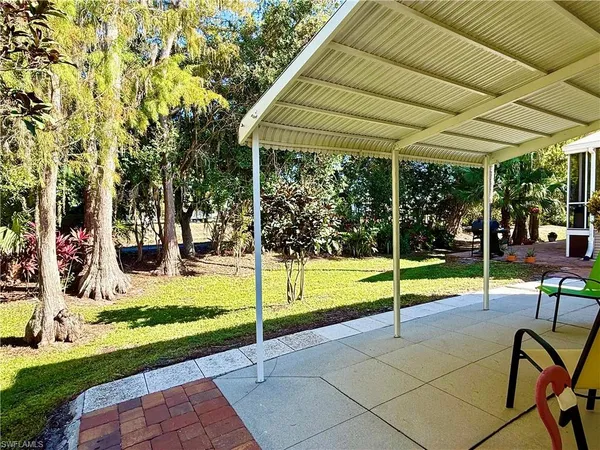 a view of yard with patio