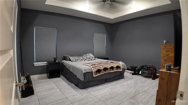 a bedroom with a bed and a table