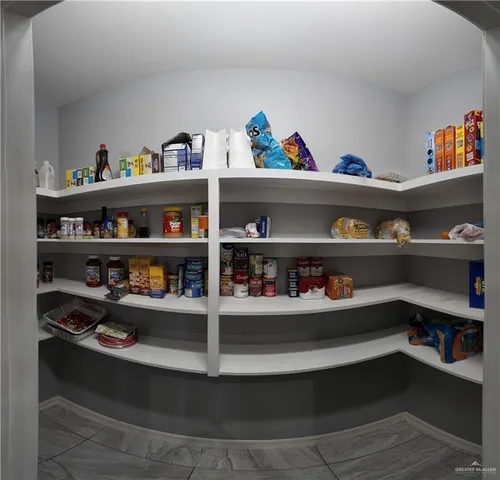 a shelf with books and knick knacks on it