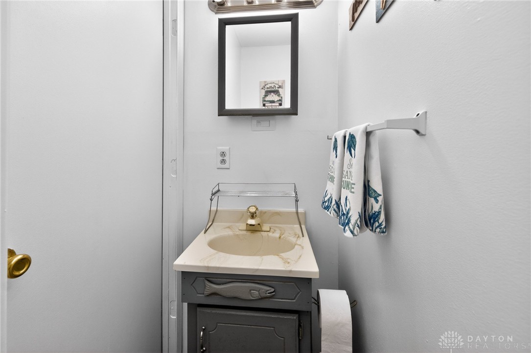 3301 Wildwood Road Middletown, OH 45042 - Photo 18 of 68 This bathroom features a single vanity, a mirror, and a towel bar.