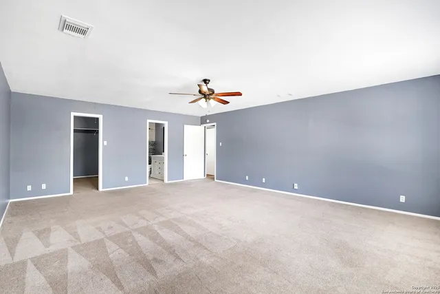 a view of an empty walk in closet