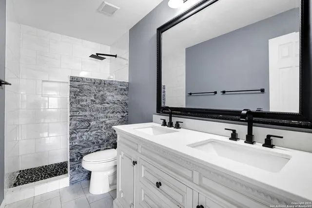 an empty room with window and ceiling fan