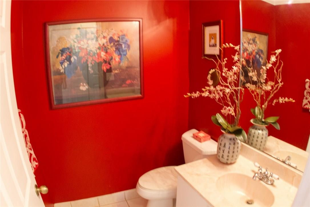 4055 Sabal Lakes Road Delray Beach, FL 33445 - Photo 12 of 13 a bathroom with a toilet and sink