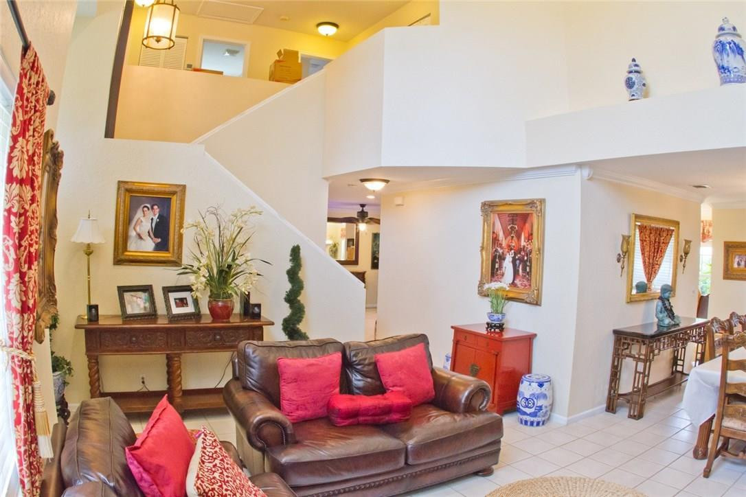 4055 Sabal Lakes Road Delray Beach, FL 33445 - Photo 2 of 13 a living room with furniture and painting on the wall