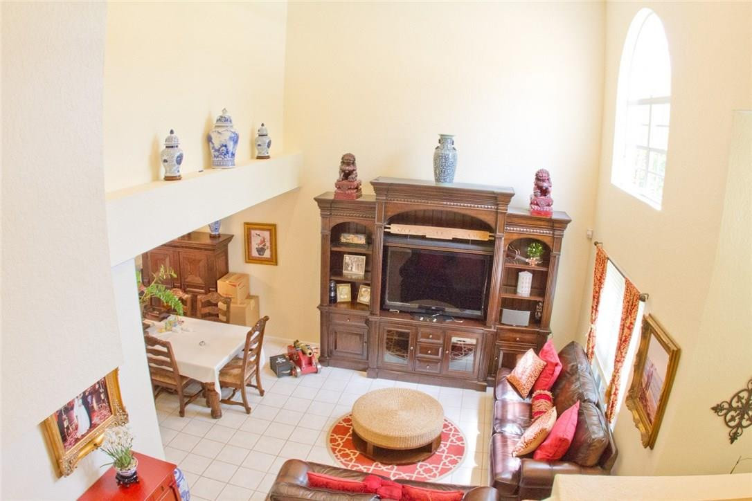 4055 Sabal Lakes Road Delray Beach, FL 33445 - Photo 3 of 13 a living room with furniture and flat screen tv