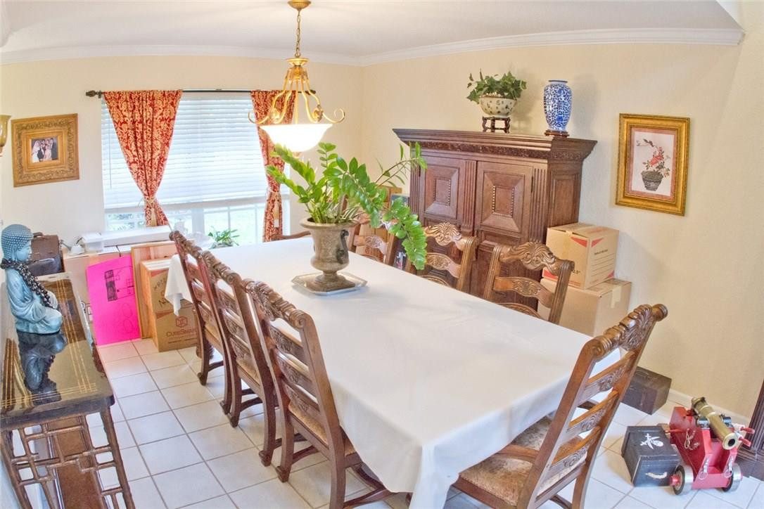 4055 Sabal Lakes Road Delray Beach, FL 33445 - Photo 5 of 13 a view of a dining room with furniture and window