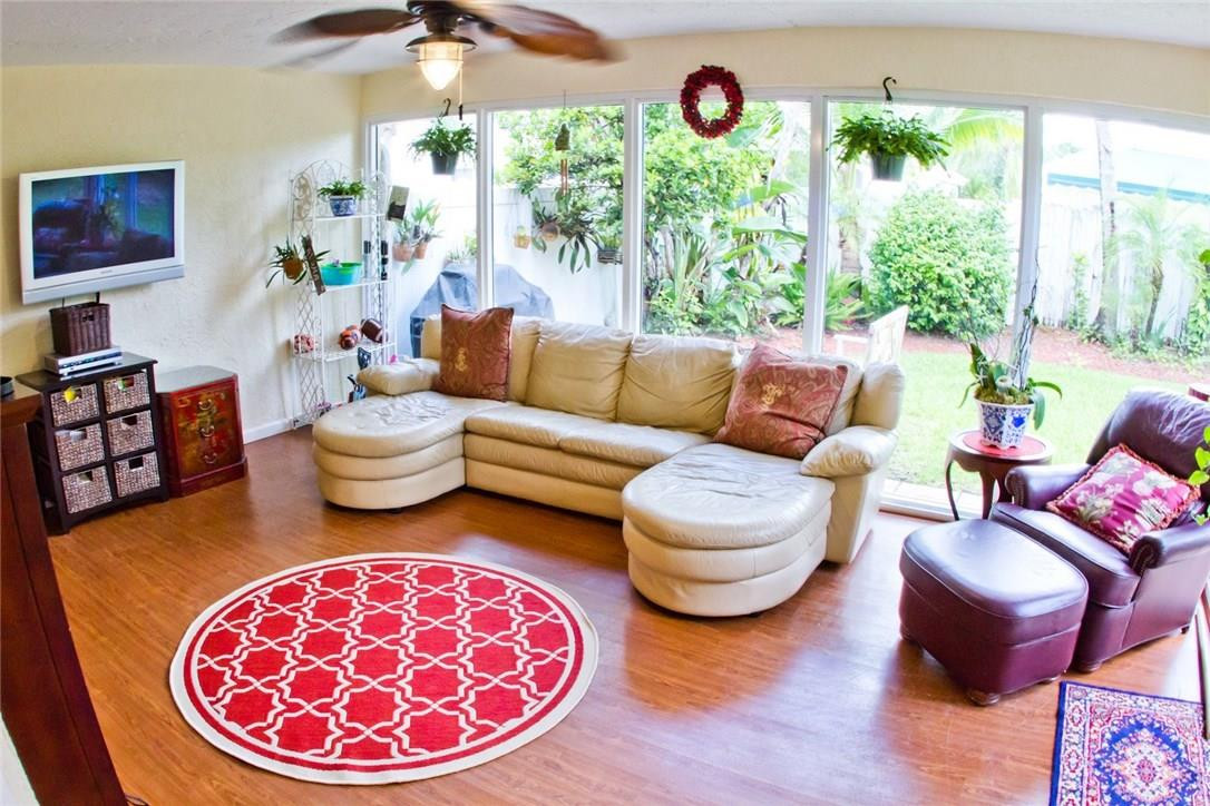 4055 Sabal Lakes Road Delray Beach, FL 33445 - Photo 6 of 13 a living room with furniture and a large window