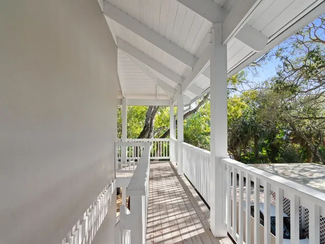 a view of balcony with wooden floor