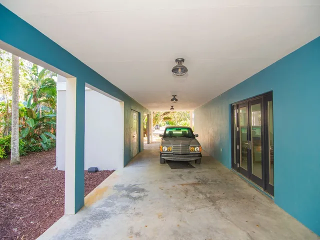 a view of living room with furniture and floor to ceiling window