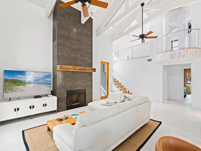 a living room with furniture and fireplace