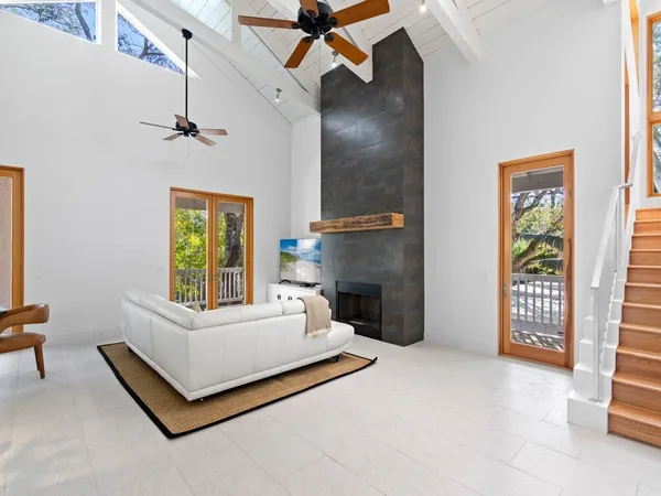 a spacious bedroom with a bed and a window