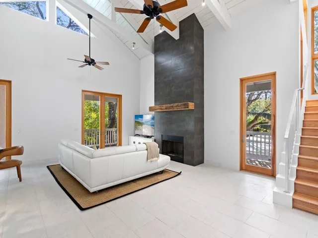 a spacious bedroom with a bed and a window