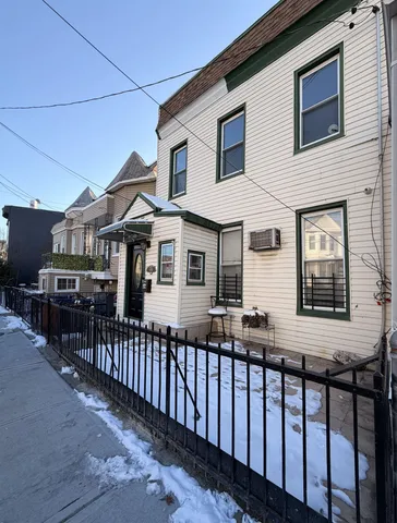 a front view of a house with glass windows