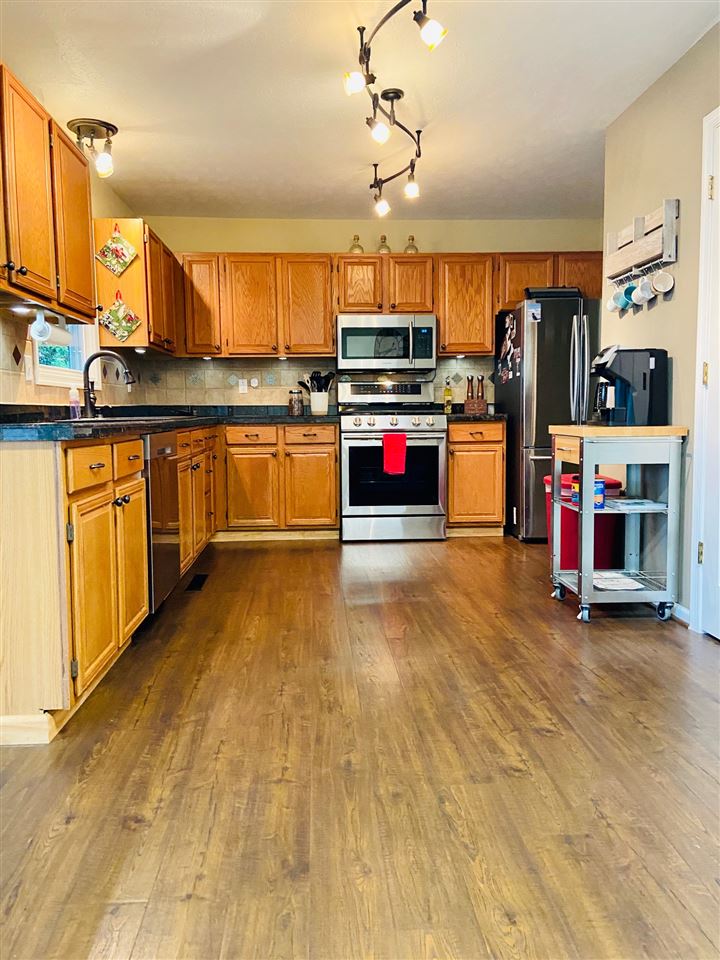 2905 Barterbrook Road Staunton, VA 24401 - Photo 7 of 33 a kitchen with stainless steel appliances kitchen island granite countertop a sink and cabinets
