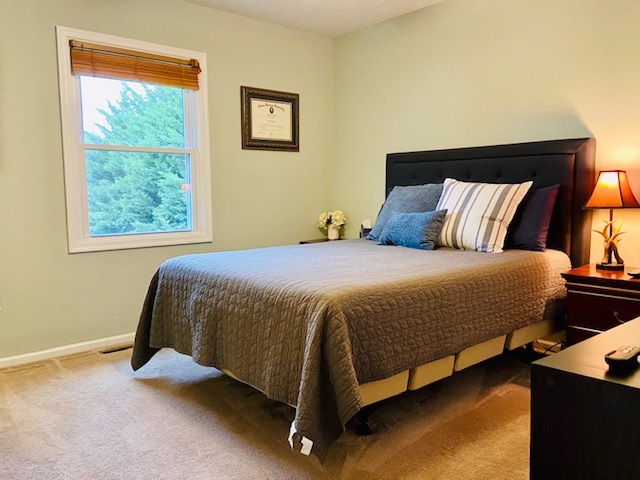 2905 Barterbrook Road Staunton, VA 24401 - Photo 10 of 33 a bed sitting in a bedroom next to a window