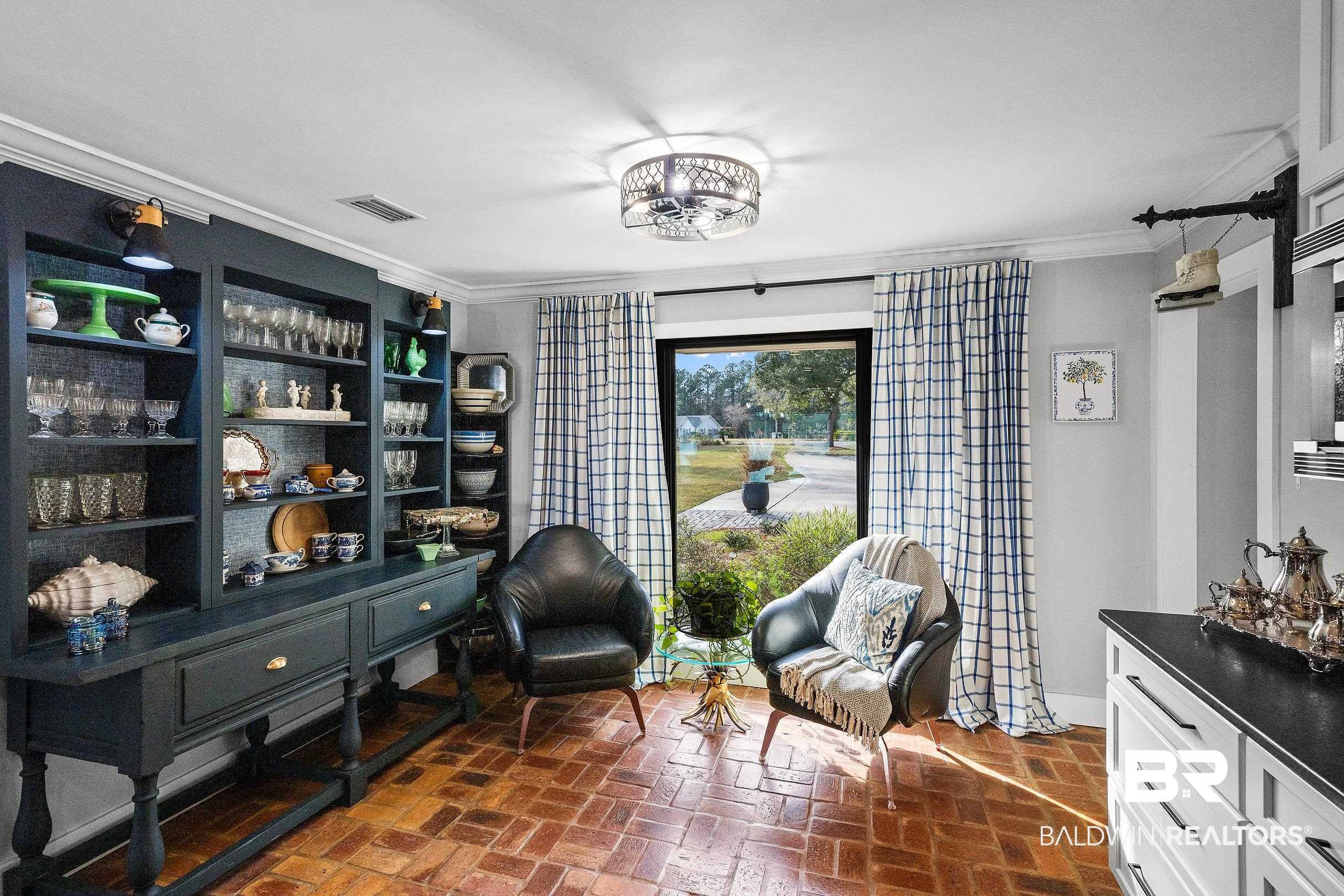 8490 Bay View Drive Foley, AL 36535 - Photo 25 of 67 Living area featuring brick floors and ornamental molding