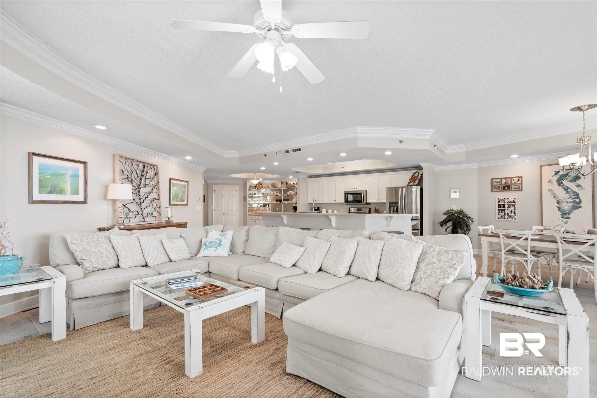 27582 Canal Road, Unit 2611 Orange Beach, AL 36561 - Photo 35 of 37 Living room with recessed lighting, crown molding, a tray ceiling, a chandelier, and a ceiling fan