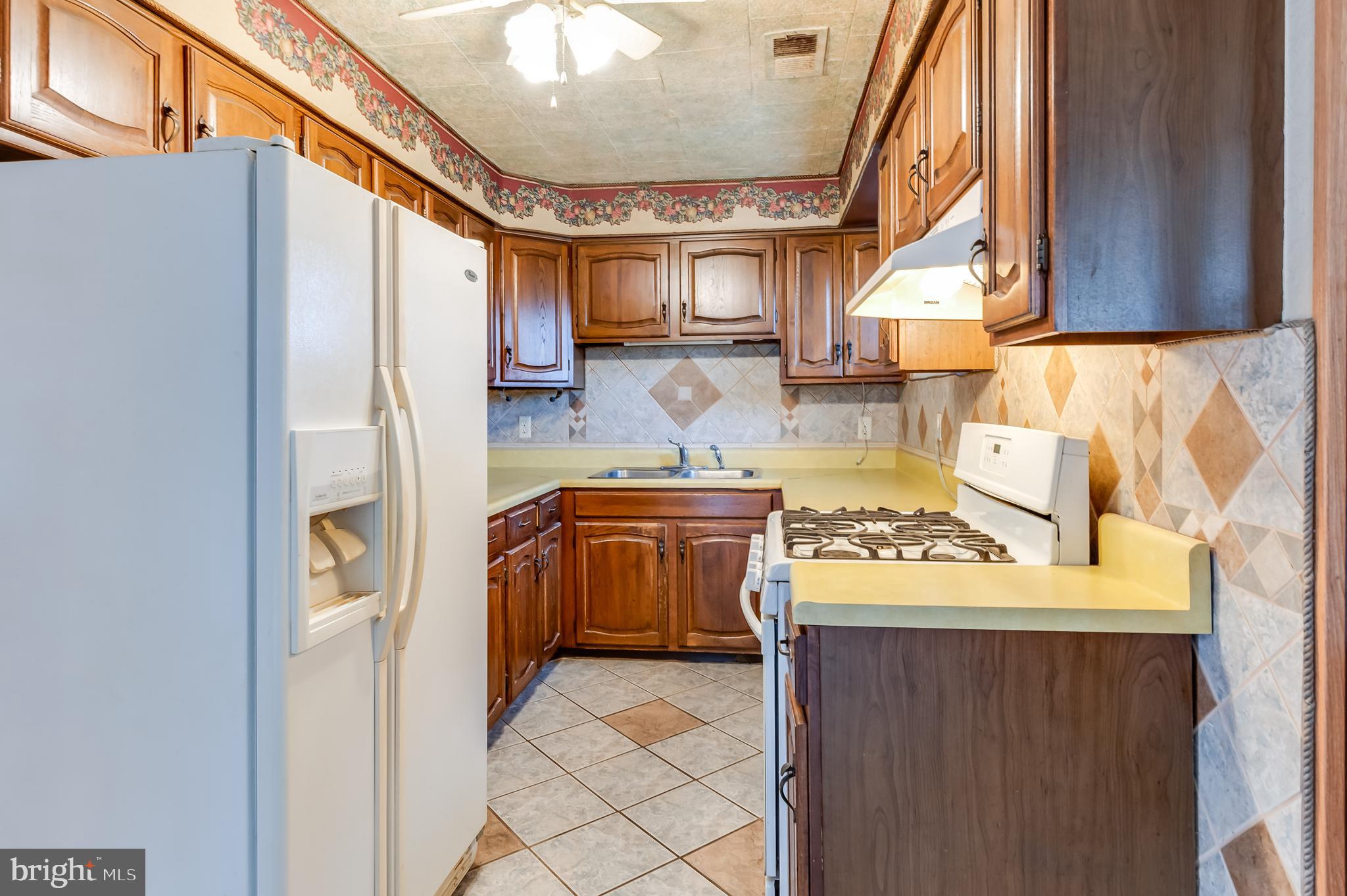 13 Stagecoach Road Southampton, NJ 08088 - Photo 16 of 42 a kitchen with stainless steel appliances granite countertop a stove and a refrigerator