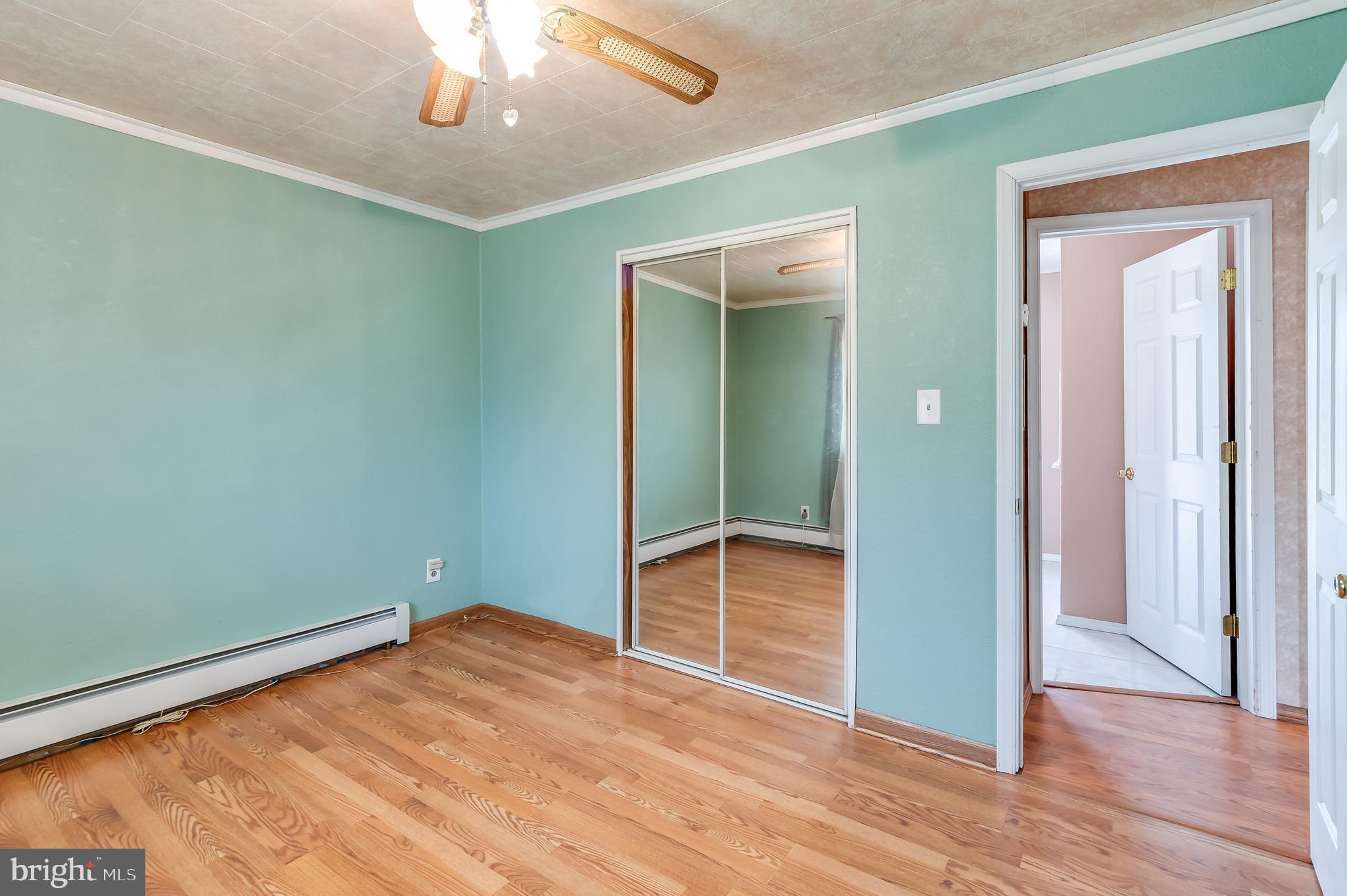 13 Stagecoach Road Southampton, NJ 08088 - Photo 18 of 42 an empty room with wooden floor closet and chandelier
