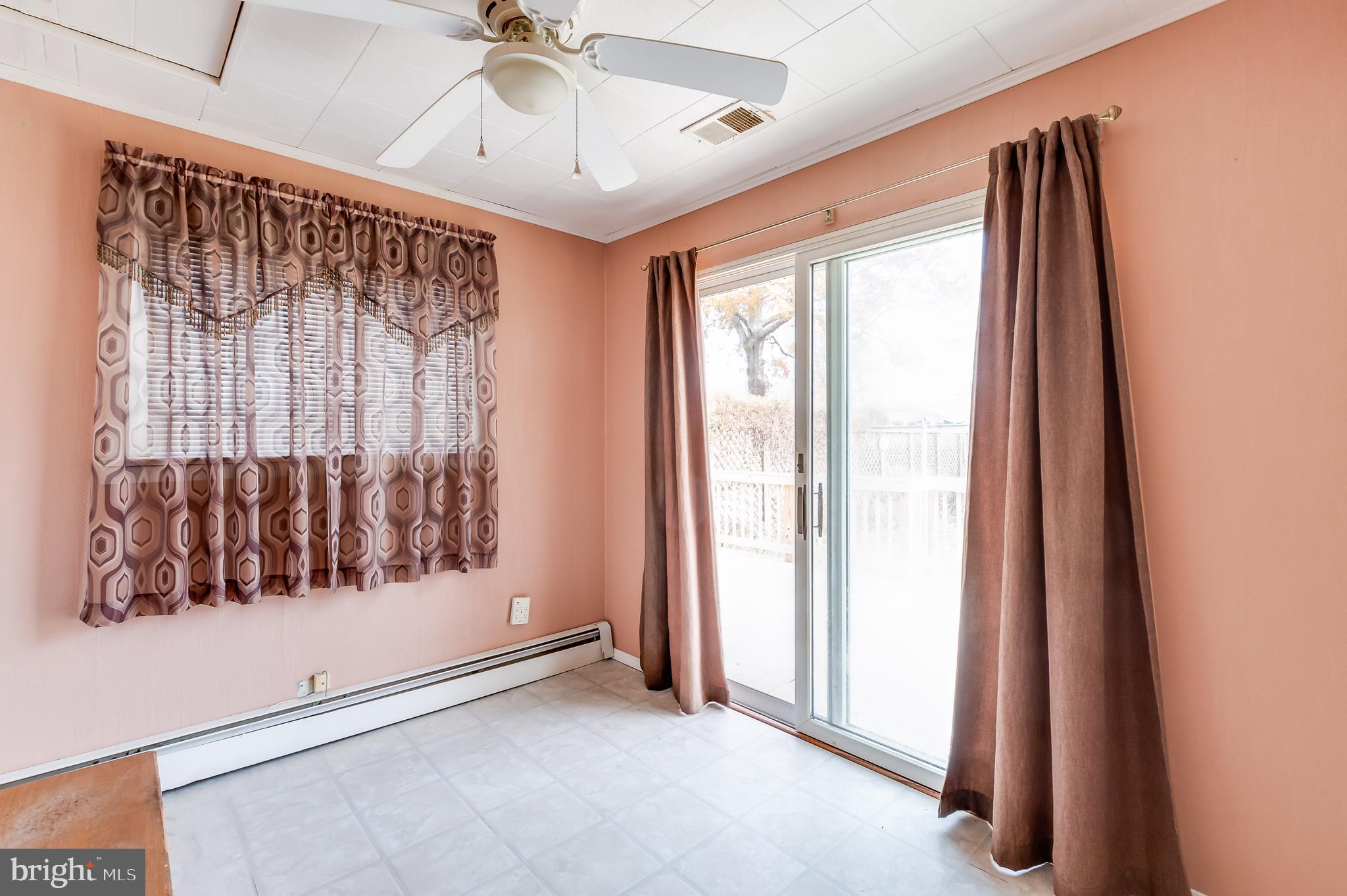 13 Stagecoach Road Southampton, NJ 08088 - Photo 20 of 42 a view of a room with a large window and chandelier