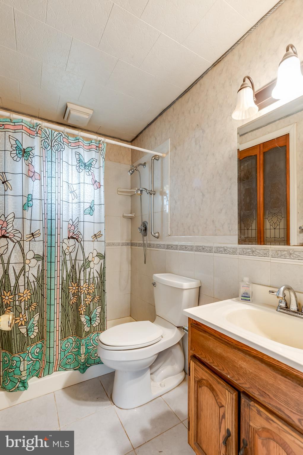 13 Stagecoach Road Southampton, NJ 08088 - Photo 21 of 42 a bathroom with a sink a toilet and shower