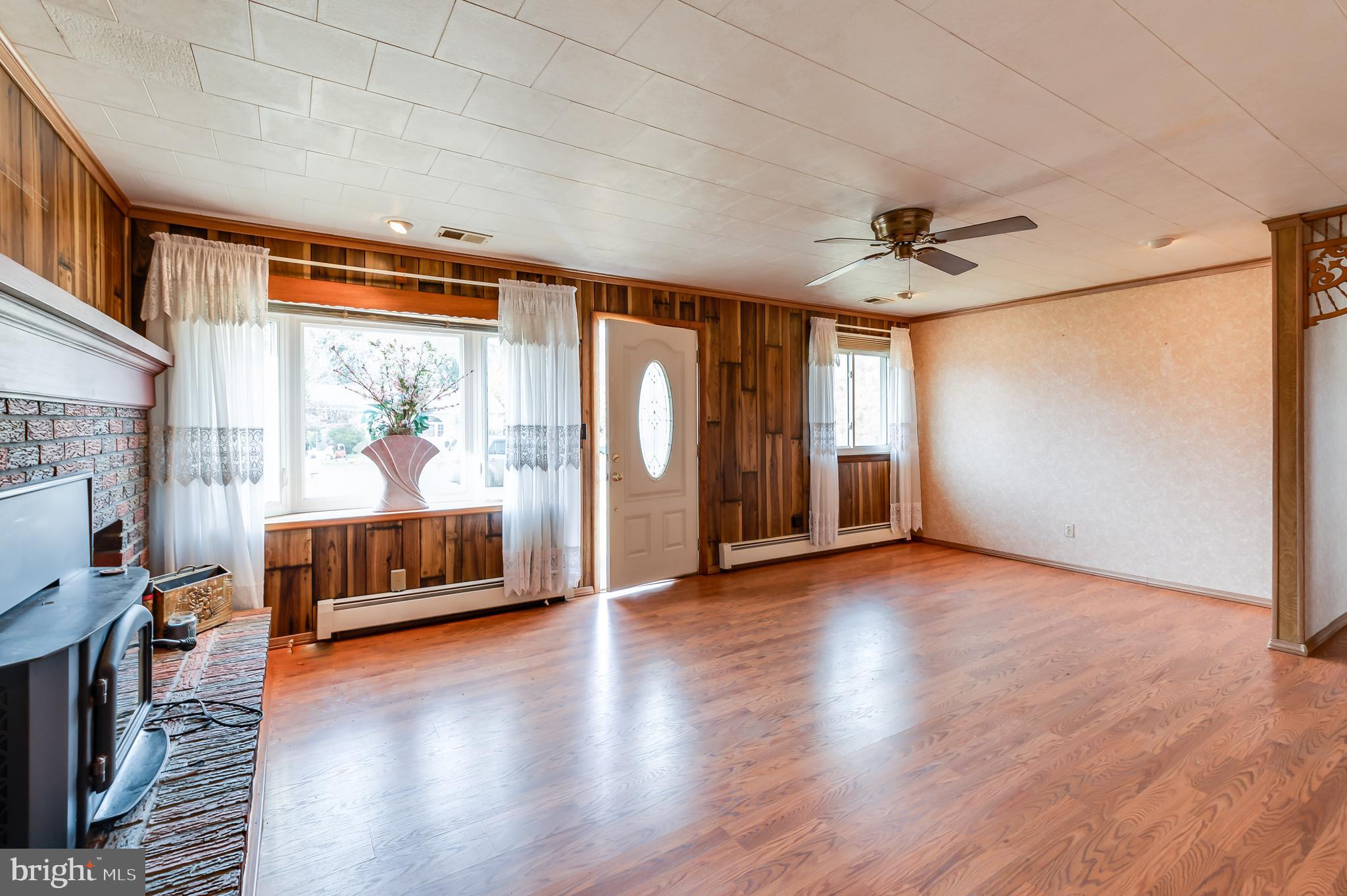 13 Stagecoach Road Southampton, NJ 08088 - Photo 5 of 42 a view of a living room a window and wooden floor