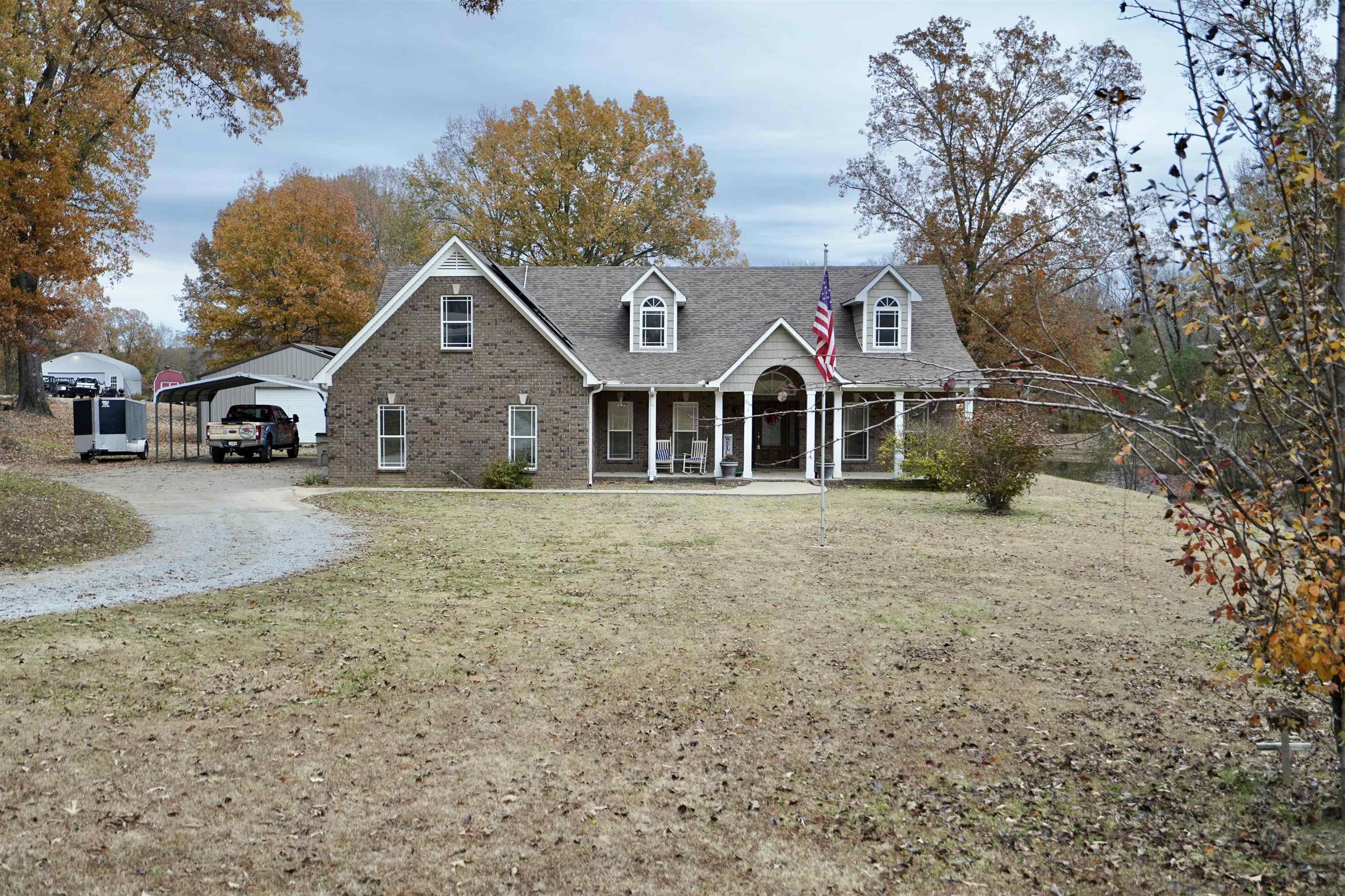 516 Egypt Road Munford, TN 38058 - Photo 1 of 40 a front view of a house with a yard and garage