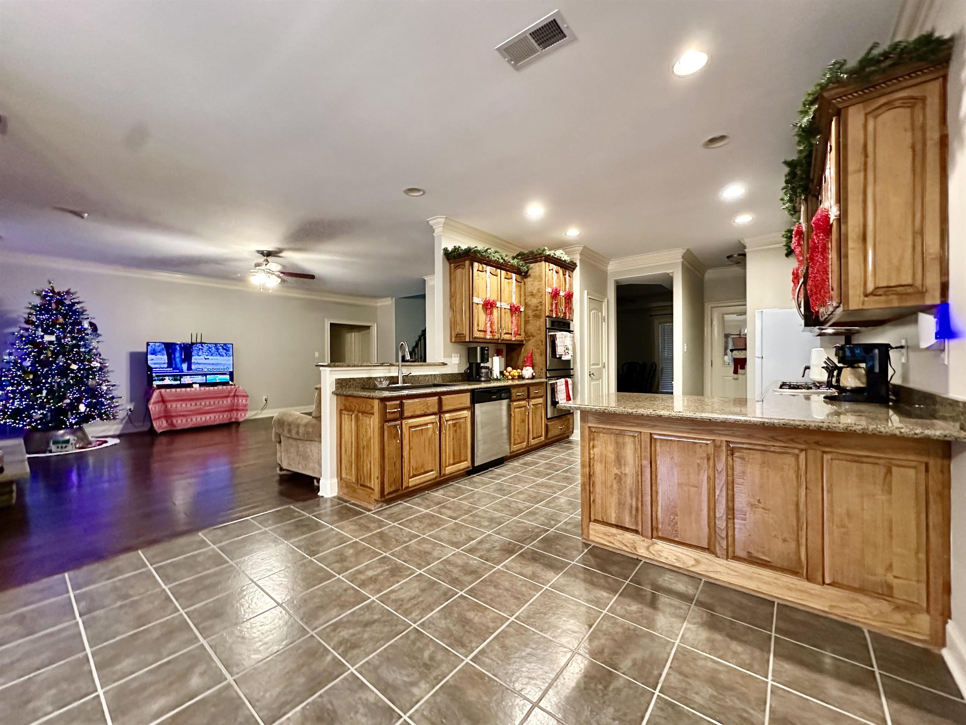 516 Egypt Road Munford, TN 38058 - Photo 39 of 40 a kitchen with granite countertop a sink and cabinets