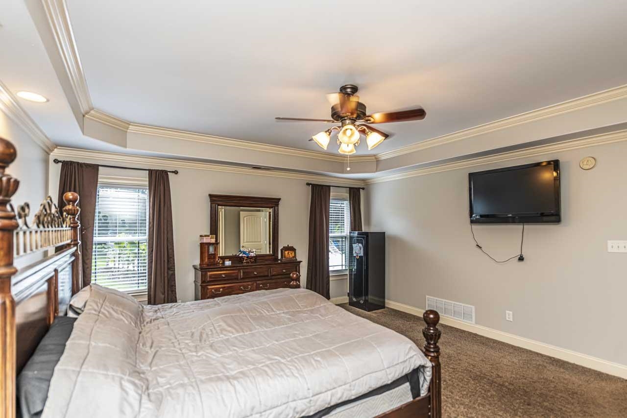 516 Egypt Road Munford, TN 38058 - Photo 19 of 40 a bedroom with a bed and a flat screen tv