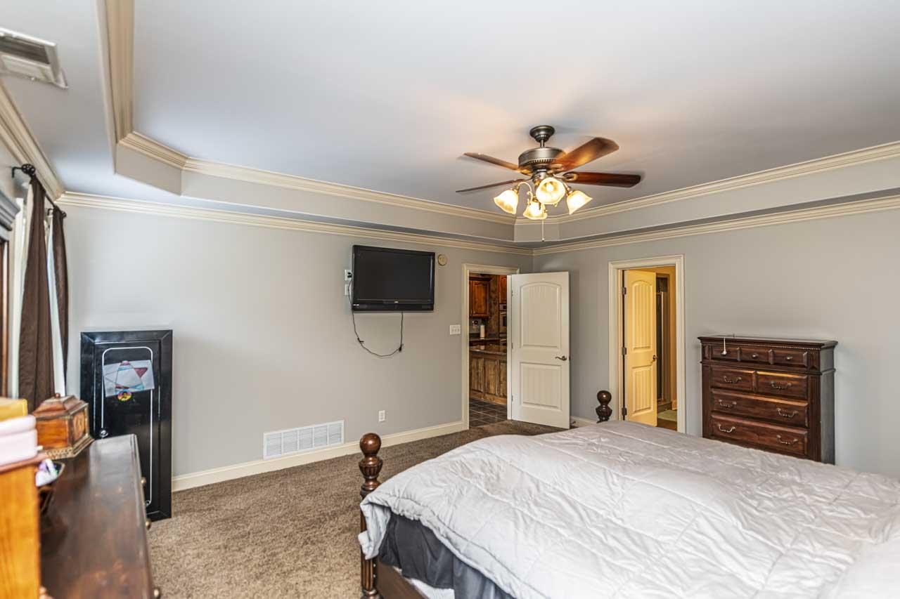 516 Egypt Road Munford, TN 38058 - Photo 20 of 40 a bedroom with a bed and a flat screen tv